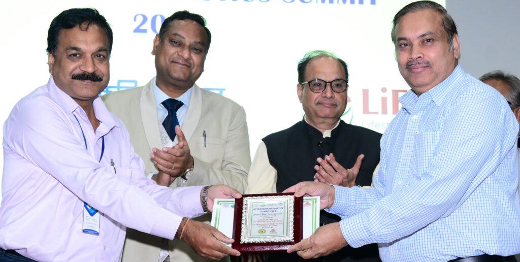 Ajay Kansal, CEO of Ballice getting awarded for their efforts by the chief guest at Uttarakhand Plastics Summit